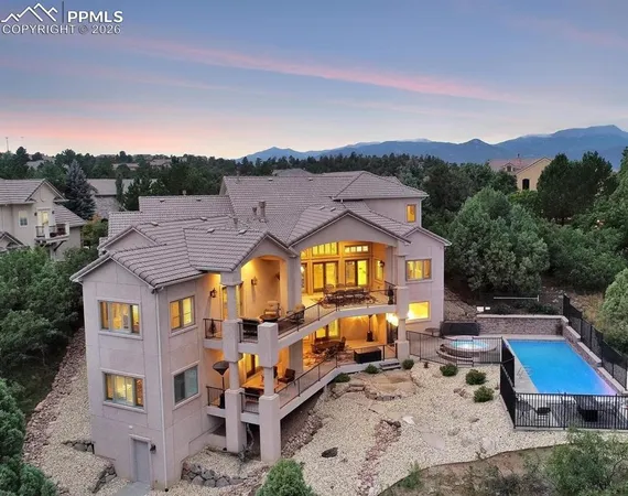 an aerial view of a house with a big yard