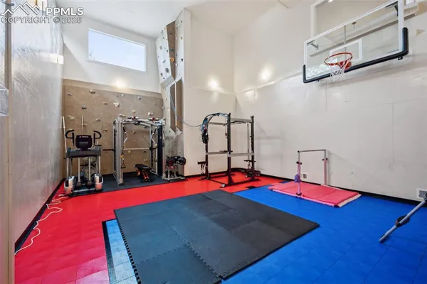 a view of gym equipment with swimming pool