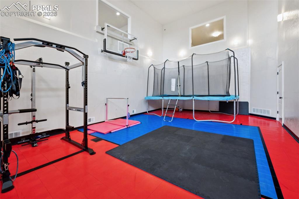 5039 Stonehill Road Colorado Springs, CO 80918 - Photo 44 of 50 a view of gym equipment with swimming pool