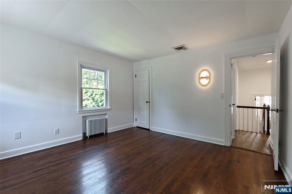 55 Forest Road Demarest, NJ 07627 - Photo 19 of 27 an empty room with windows and entrance