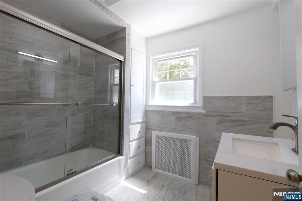 55 Forest Road Demarest, NJ 07627 - Photo 21 of 27 a bathroom with a sink toilet and shower