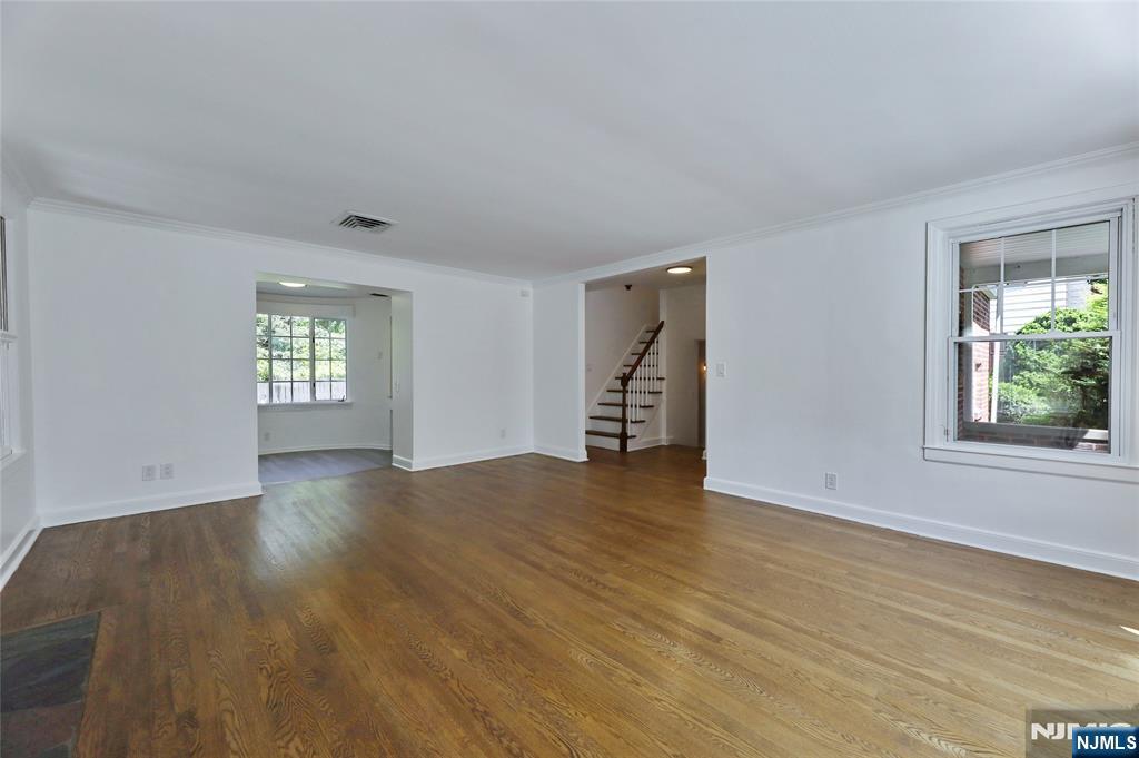 55 Forest Road Demarest, NJ 07627 - Photo 6 of 27 an empty room with wooden floor and windows