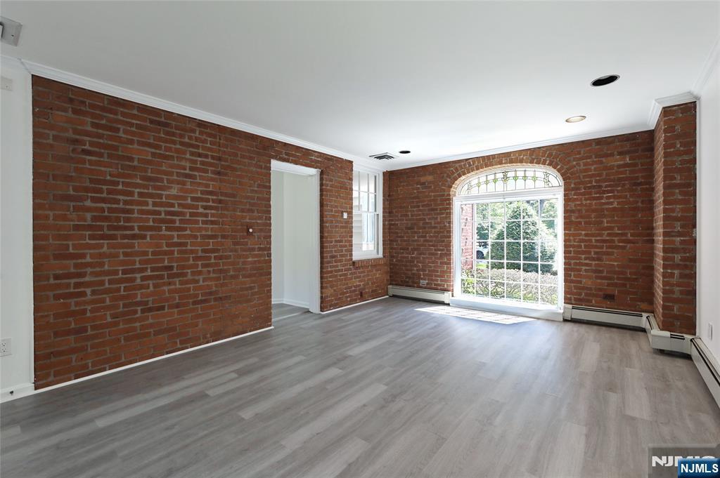 55 Forest Road Demarest, NJ 07627 - Photo 8 of 27 a view of an empty room with wooden floor and a window