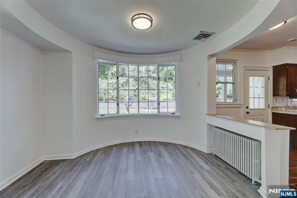 55 Forest Road Demarest, NJ 07627 - Photo 9 of 27 wooden floor in an empty room with a window