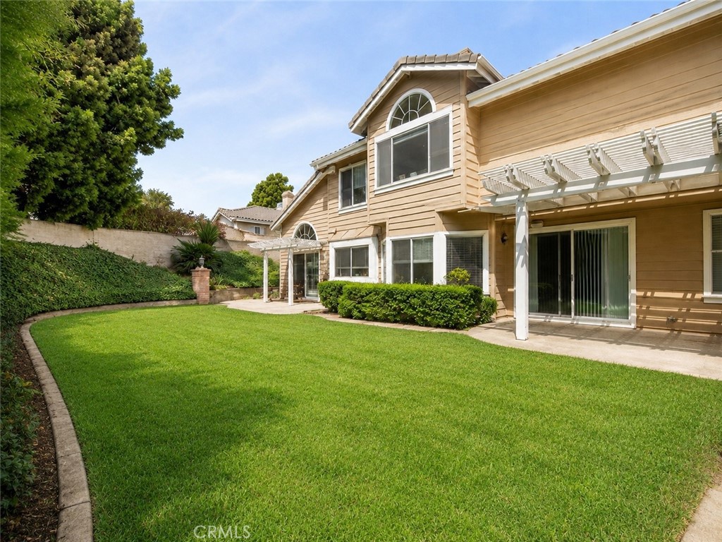 2811 North Roxbury Street Orange, CA 92867 - Photo 17 of 22 a front view of a house with a yard