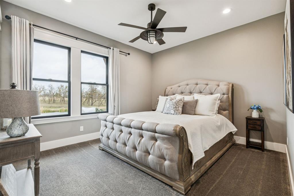 2577 Lone Star Road, Unit 1 Celina, TX 75009 - Photo 14 of 40 a bed room with a bed and a chair