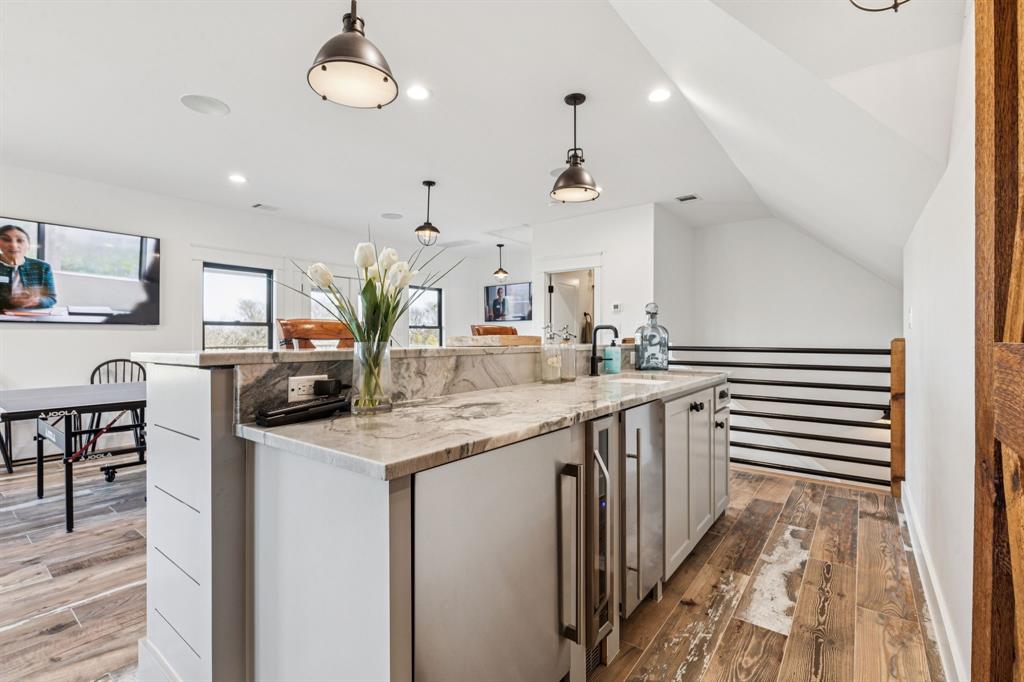 2577 Lone Star Road, Unit 1 Celina, TX 75009 - Photo 16 of 40 a kitchen with sink cabinets and window