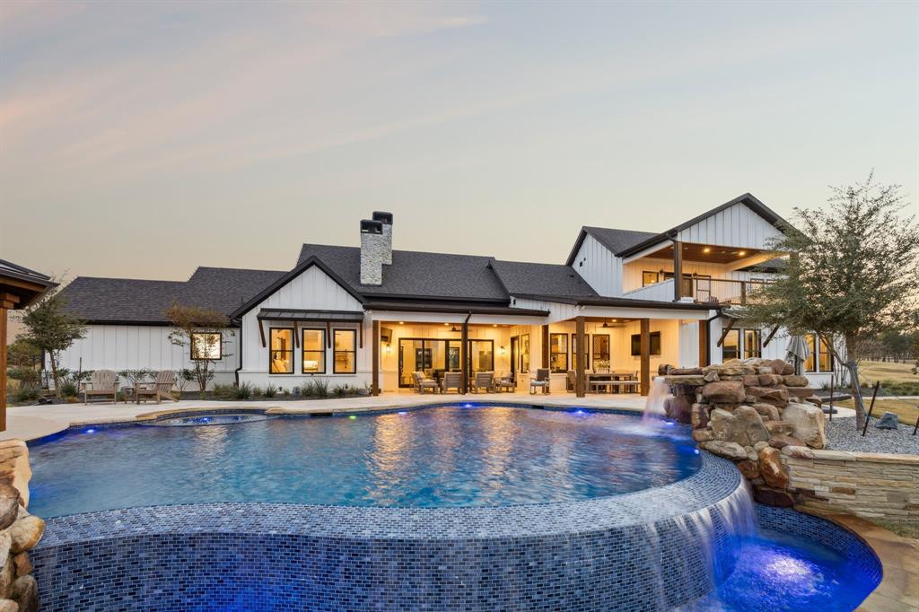 2577 Lone Star Road, Unit 1 Celina, TX 75009 - Photo 18 of 40 a front view of a house with a yard