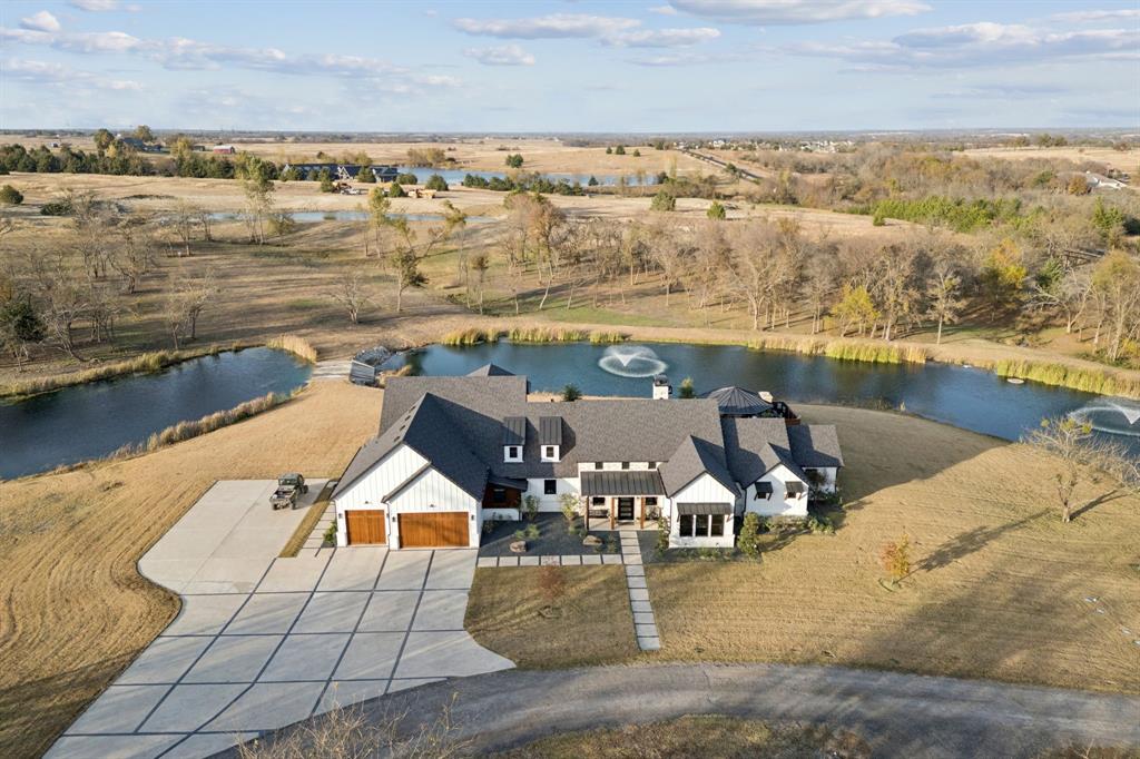 2577 Lone Star Road, Unit 1 Celina, TX 75009 - Photo 21 of 40 an aerial view of residential houses with outdoor space