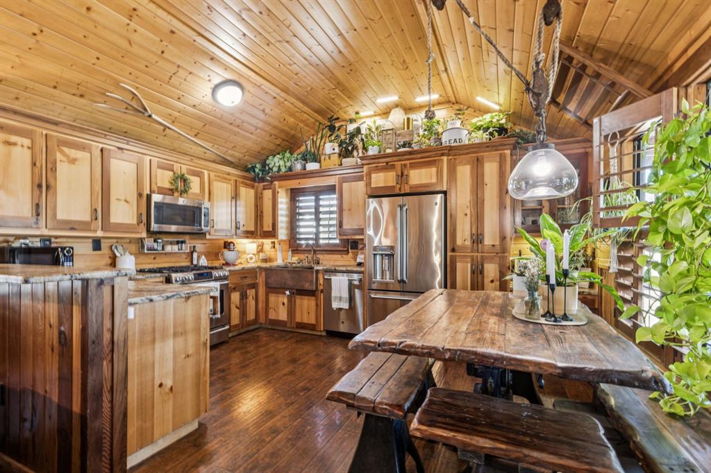 2577 Lone Star Road, Unit 1 Celina, TX 75009 - Photo 25 of 40 a view of a dining room with furniture window and wooden floor