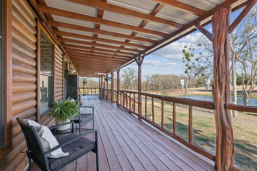 2577 Lone Star Road, Unit 1 Celina, TX 75009 - Photo 27 of 40 a porch with wooden floor in outdoor space