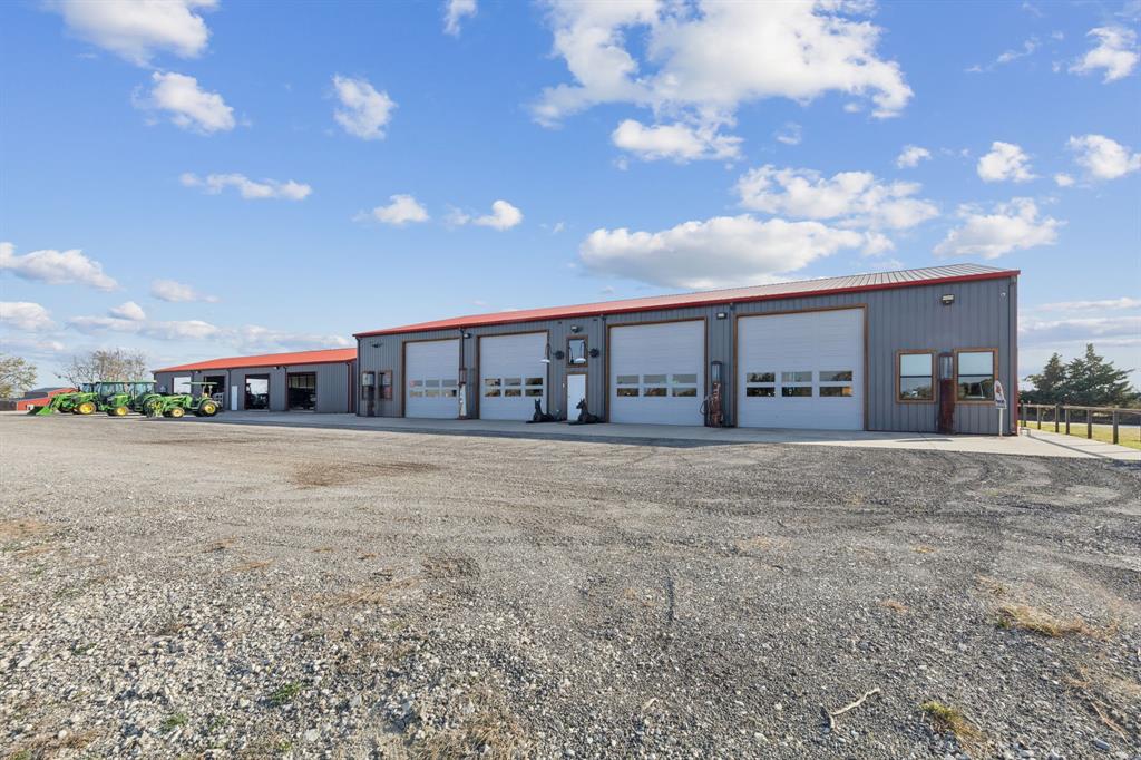 2577 Lone Star Road, Unit 1 Celina, TX 75009 - Photo 28 of 40 a view of a house with a yard and a garage