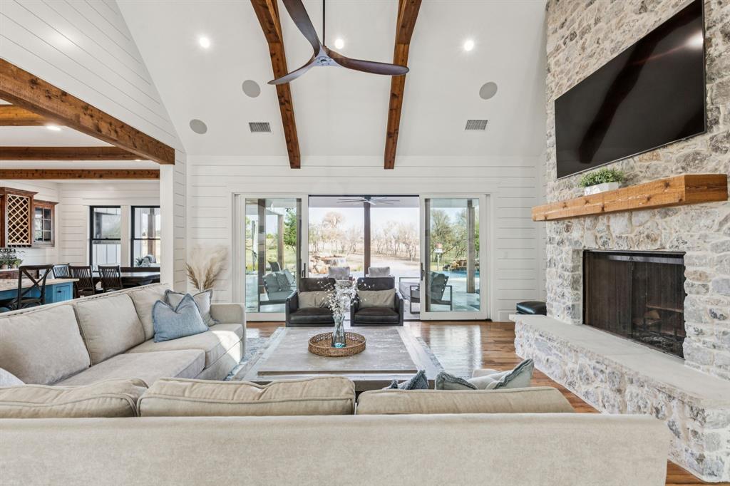 2577 Lone Star Road, Unit 1 Celina, TX 75009 - Photo 3 of 40 a living room with furniture fireplace and flat screen tv