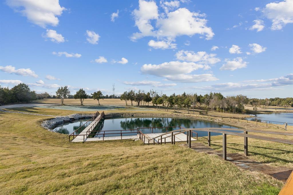 2577 Lone Star Road, Unit 1 Celina, TX 75009 - Photo 33 of 40 a view of a lake with couches chairs
