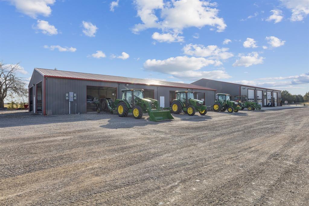 2577 Lone Star Road, Unit 1 Celina, TX 75009 - Photo 34 of 40 a group of people sitting in front of a building