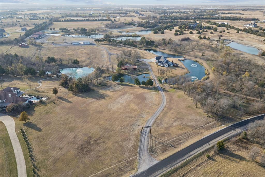2577 Lone Star Road, Unit 1 Celina, TX 75009 - Photo 38 of 40 an aerial view of residential houses with outdoor space