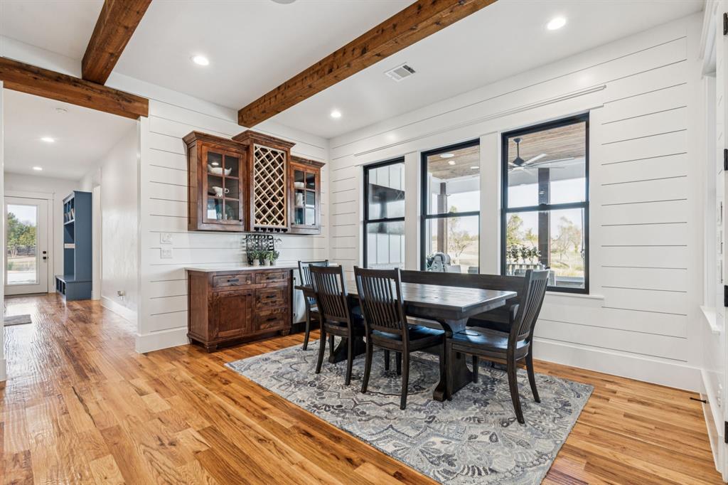 2577 Lone Star Road, Unit 1 Celina, TX 75009 - Photo 7 of 40 a view of a a dining room with furniture window and wooden floor