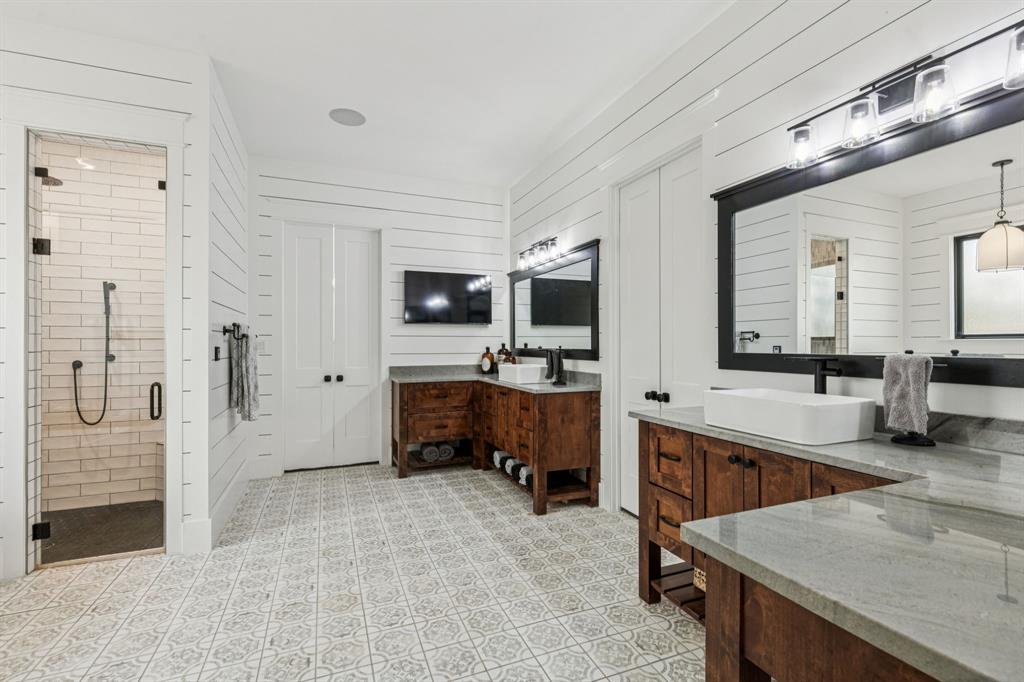 2577 Lone Star Road, Unit 1 Celina, TX 75009 - Photo 9 of 40 a large white kitchen with a large window and stainless steel appliances