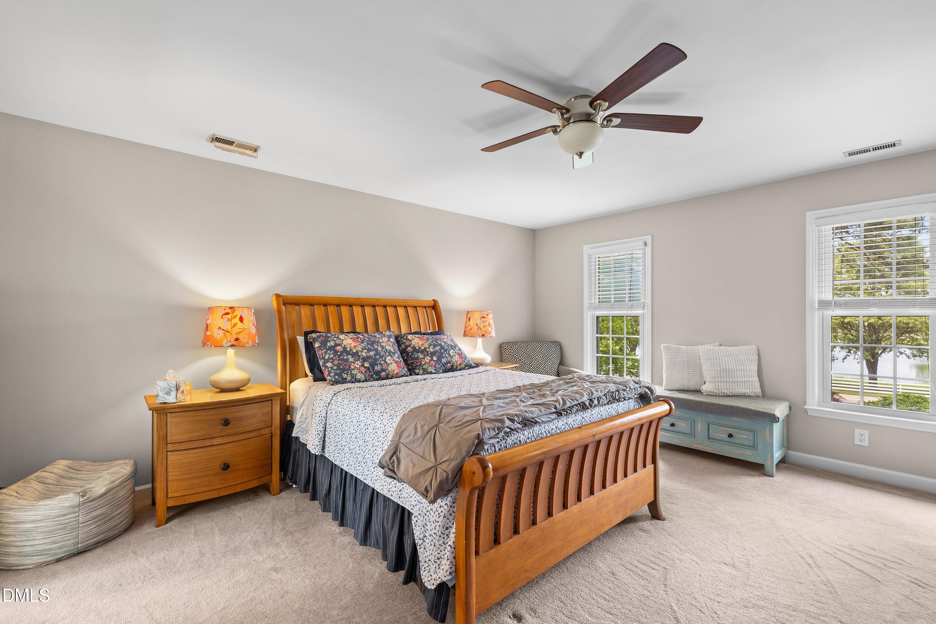 6612 Fowler Road Zebulon, NC 27597 - Photo 23 of 42 a bedroom with a bed and a window