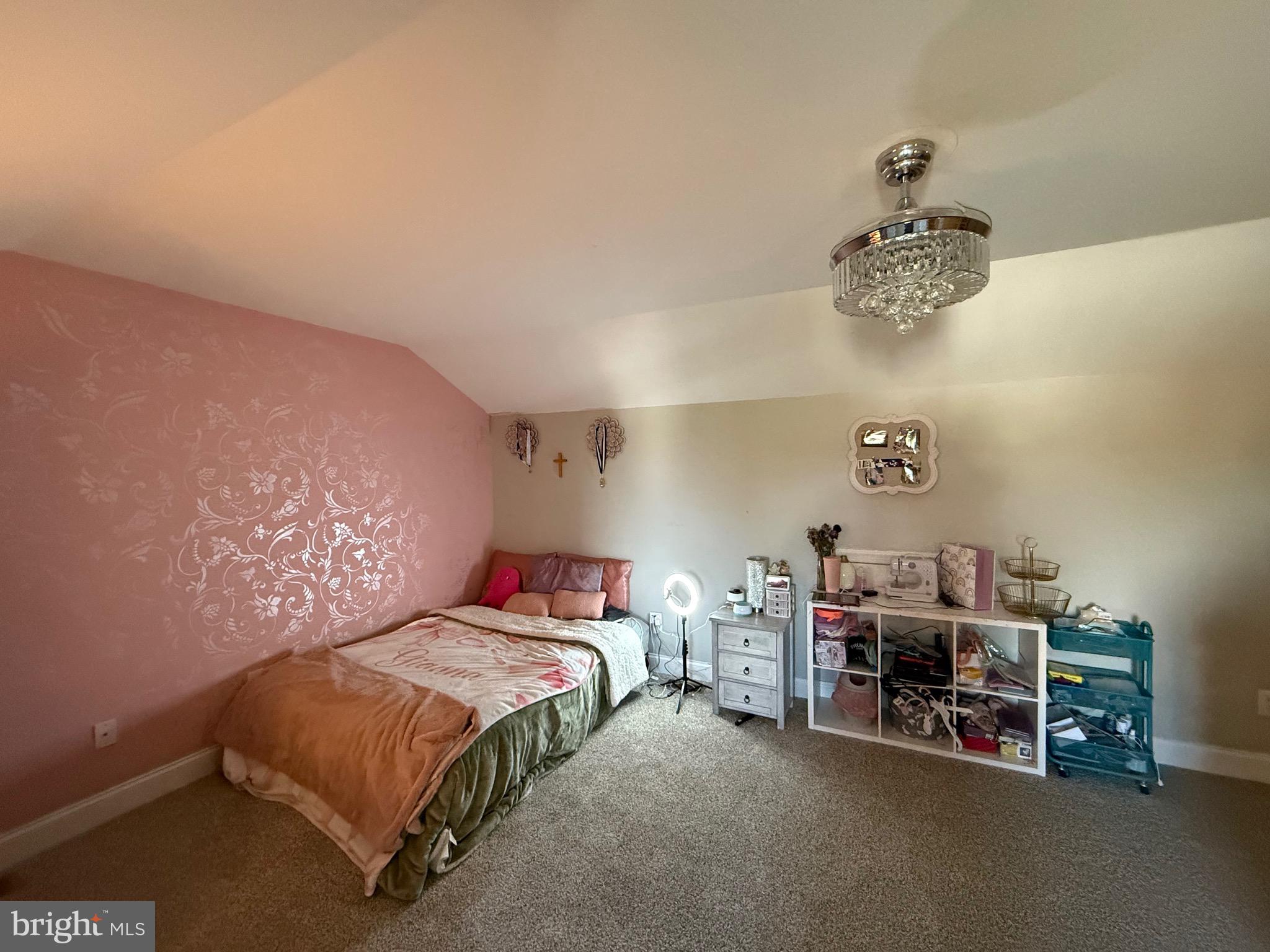 27 Bishop Pine Road Barto, PA 19504 - Photo 19 of 20 a bedroom with a bed and a chandelier
