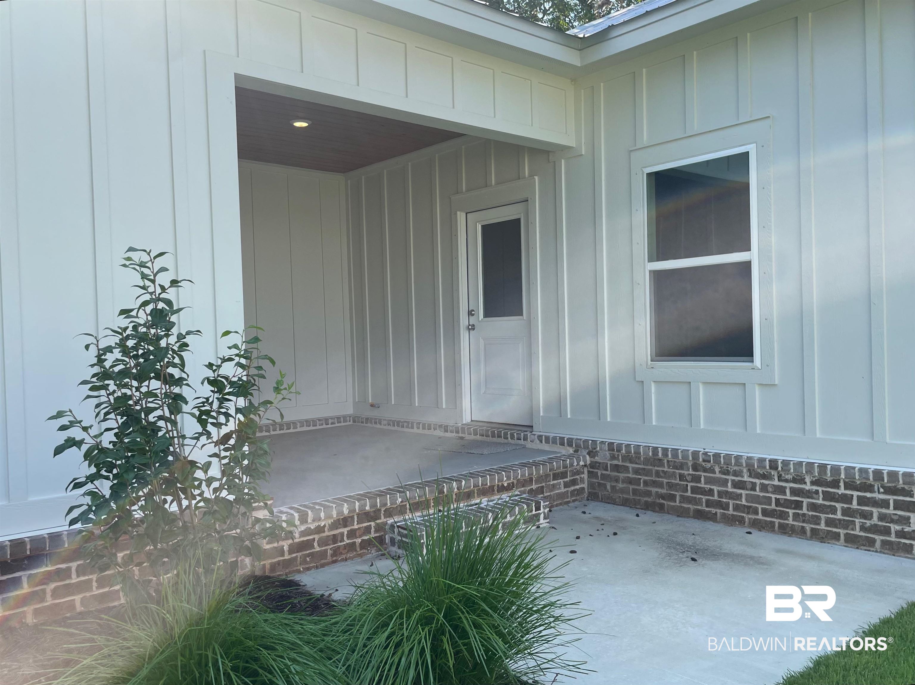 14710 Camelia Street Magnolia Springs, AL 36555 - Photo 14 of 23 Property entrance featuring a patio