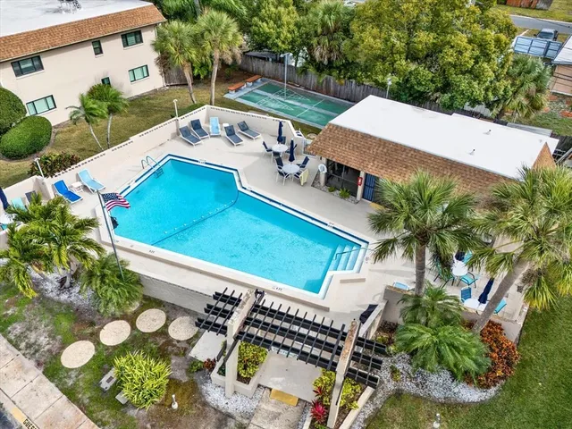 an aerial view of a house with outdoor space