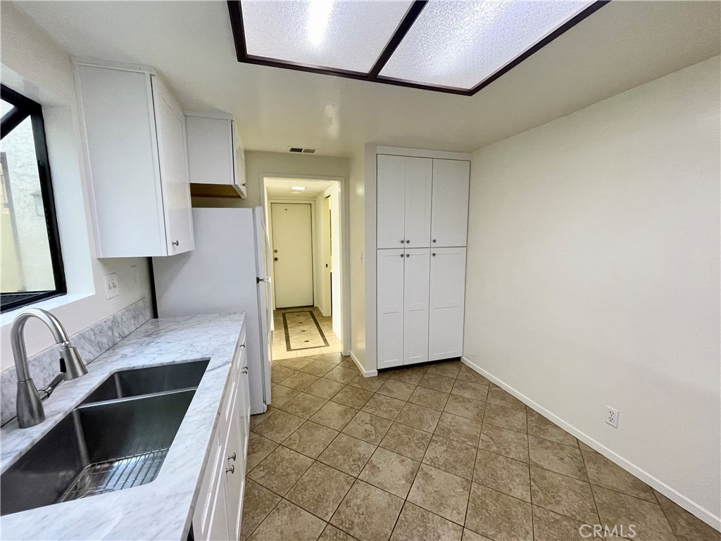 17 Grenache, Unit 72 Irvine, CA 92614 - Photo 13 of 20 a kitchen with stainless steel appliances granite countertop a sink and a stove