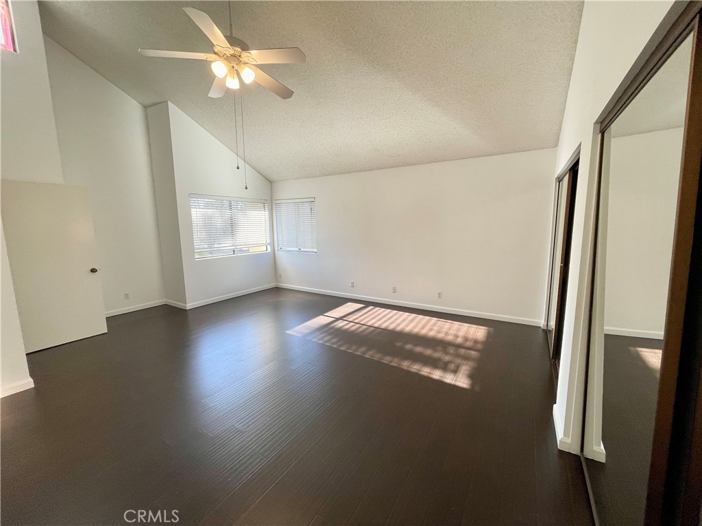 17 Grenache, Unit 72 Irvine, CA 92614 - Photo 14 of 20 an empty room with wooden floor and window