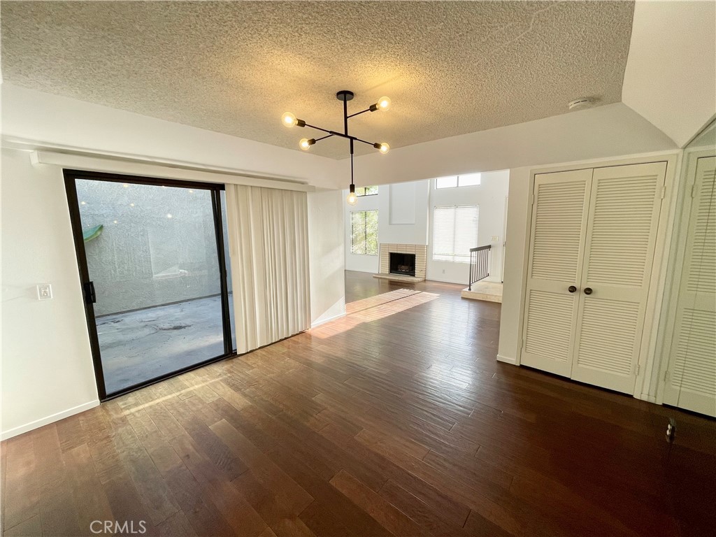 17 Grenache, Unit 72 Irvine, CA 92614 - Photo 8 of 20 a view of a kitchen with wooden floor and a ceiling fan