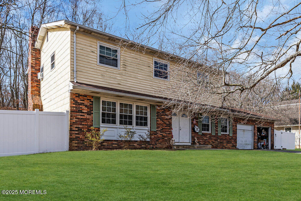 52 Newbury Road Howell, NJ 07731 - Photo 1 of 31 a view of a house with a yard