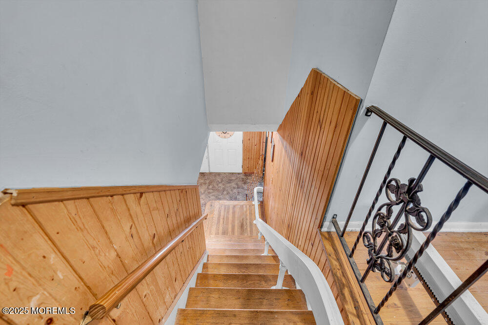 52 Newbury Road Howell, NJ 07731 - Photo 17 of 31 a view of staircase with railing and white walls
