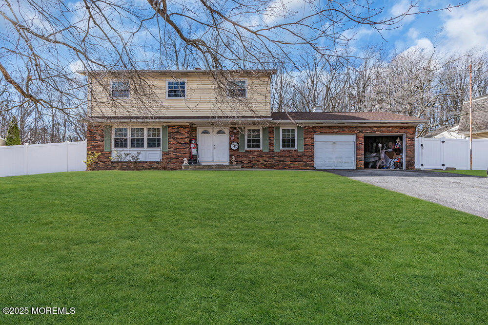 52 Newbury Road Howell, NJ 07731 - Photo 2 of 31 a view of a building with a yard