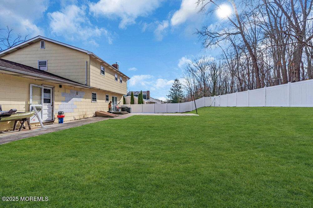 52 Newbury Road Howell, NJ 07731 - Photo 22 of 31 a front view of house with yard