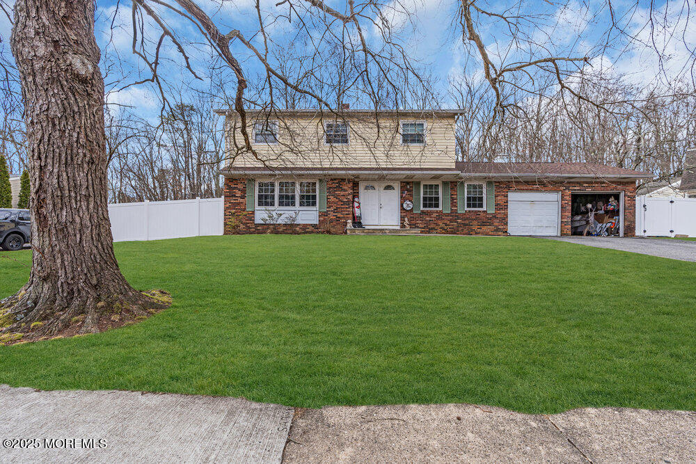 52 Newbury Road Howell, NJ 07731 - Photo 4 of 31 a view of a building with a garden