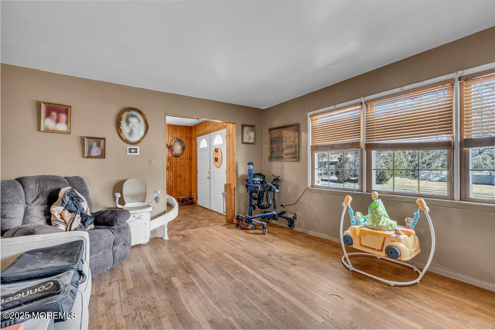 52 Newbury Road Howell, NJ 07731 - Photo 5 of 31 a room with gym equipment and a large window