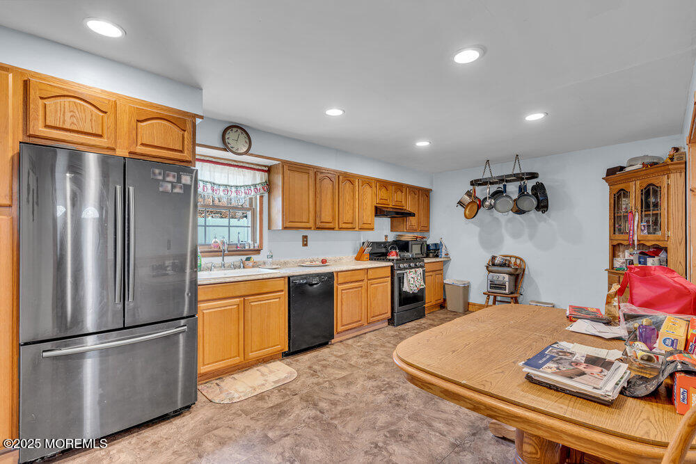 52 Newbury Road Howell, NJ 07731 - Photo 10 of 31 a kitchen with stainless steel appliances granite countertop a refrigerator sink and stove