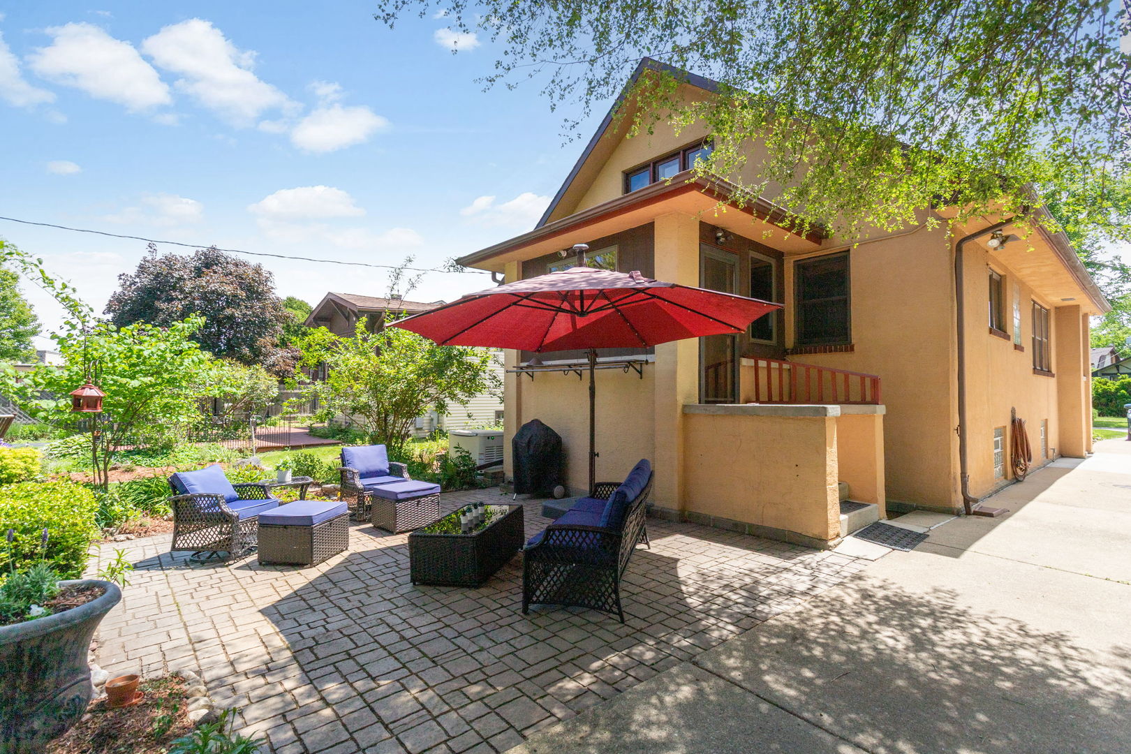 342 Lawton Road Riverside, IL 60546 - Photo 24 of 33 a view of a patio with a table and chairs under an umbrella