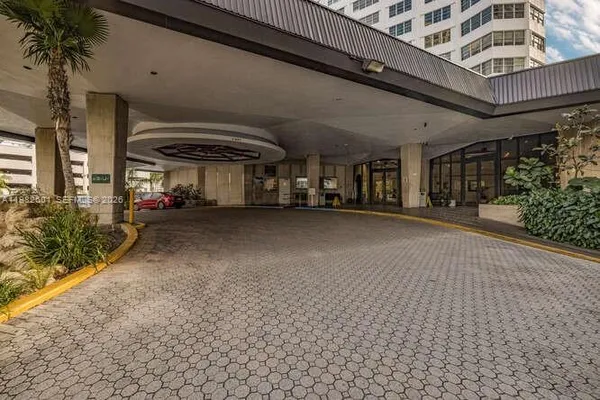a view of a lobby with furniture and a potted plant