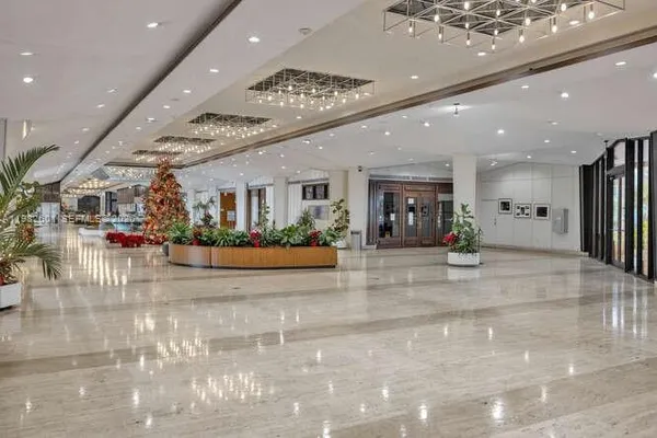 a kitchen with stainless steel appliances granite countertop a sink and wooden cabinets