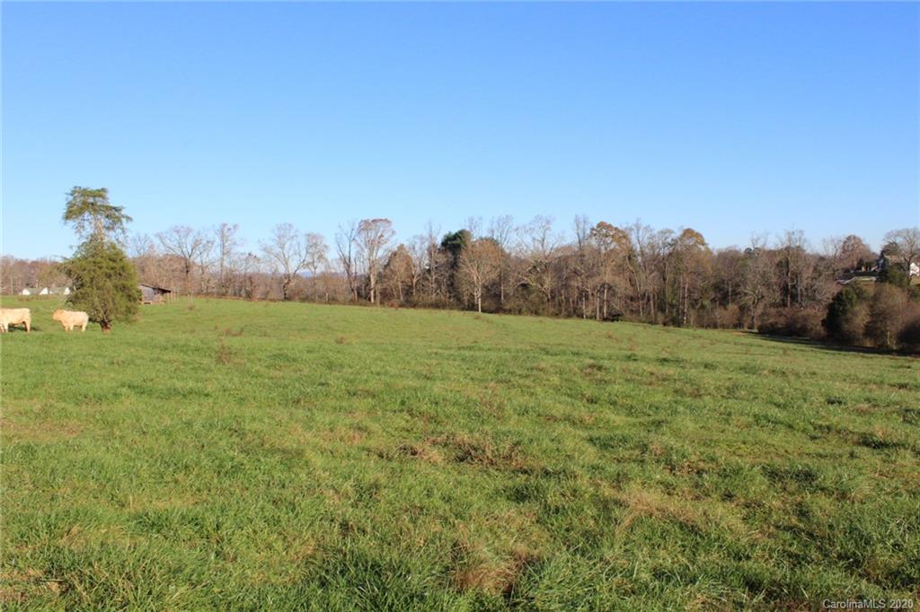 0 Calhoun Road Stony Point, NC 28678 - Photo 26 of 48 a view of a field of grass and trees