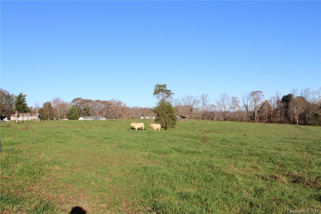 0 Calhoun Road Stony Point, NC 28678 - Photo 27 of 48 a view of a grassy field with trees