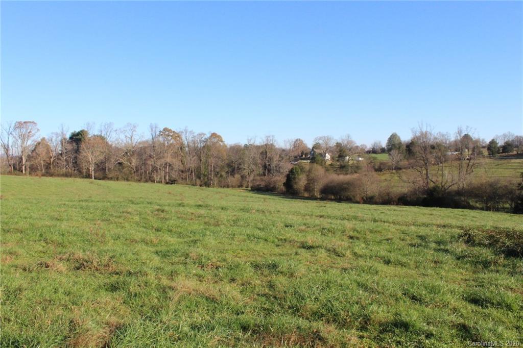 0 Calhoun Road Stony Point, NC 28678 - Photo 28 of 48 a view of a field of grass and trees