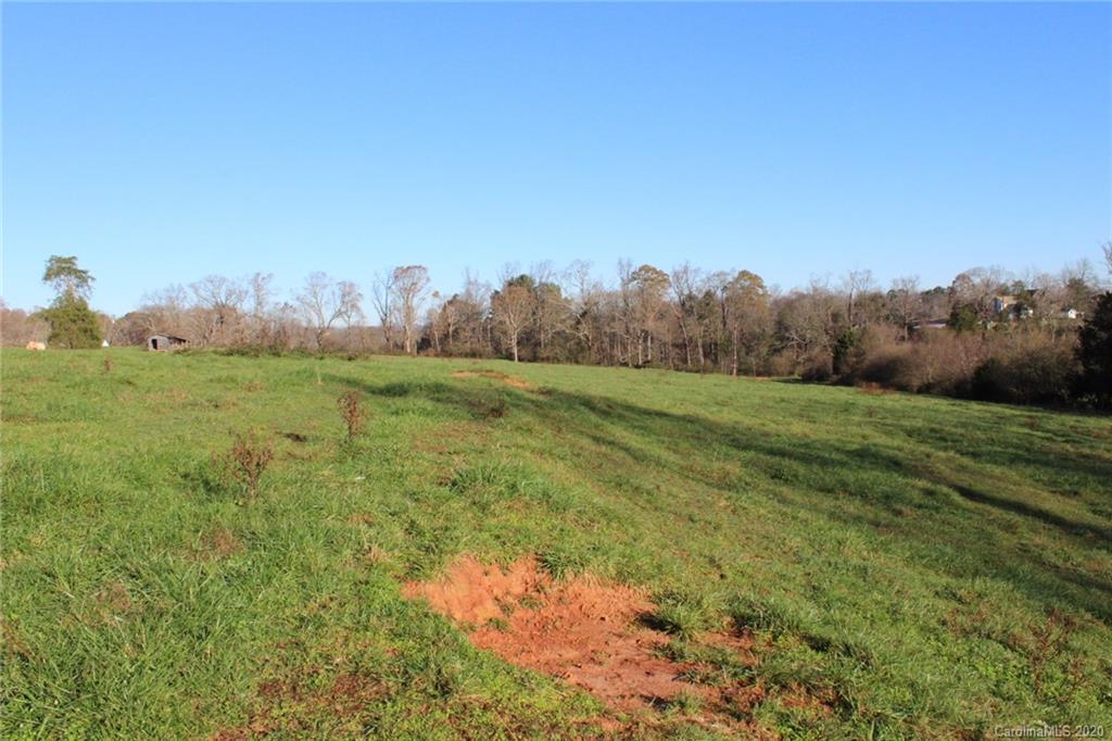0 Calhoun Road Stony Point, NC 28678 - Photo 29 of 48 a view of a field of grass and trees
