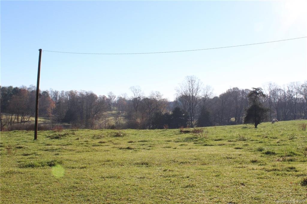 0 Calhoun Road Stony Point, NC 28678 - Photo 4 of 48 a view of a field with a tree in the background