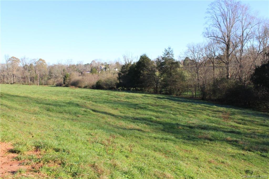 0 Calhoun Road Stony Point, NC 28678 - Photo 31 of 48 a view of a grassy field with trees in the background