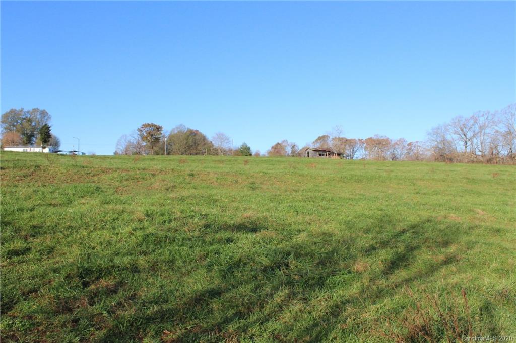 0 Calhoun Road Stony Point, NC 28678 - Photo 42 of 48 a view of a grassy field with an trees