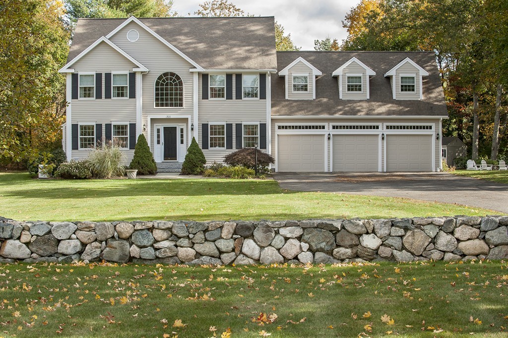 321 Concord Road Wayland, MA 01778 - Photo 1 of 12 a view of a white house with a yard