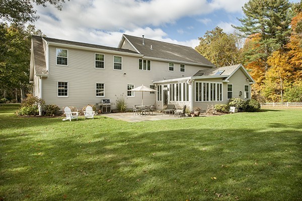 321 Concord Road Wayland, MA 01778 - Photo 11 of 12 a front view of a house with garden