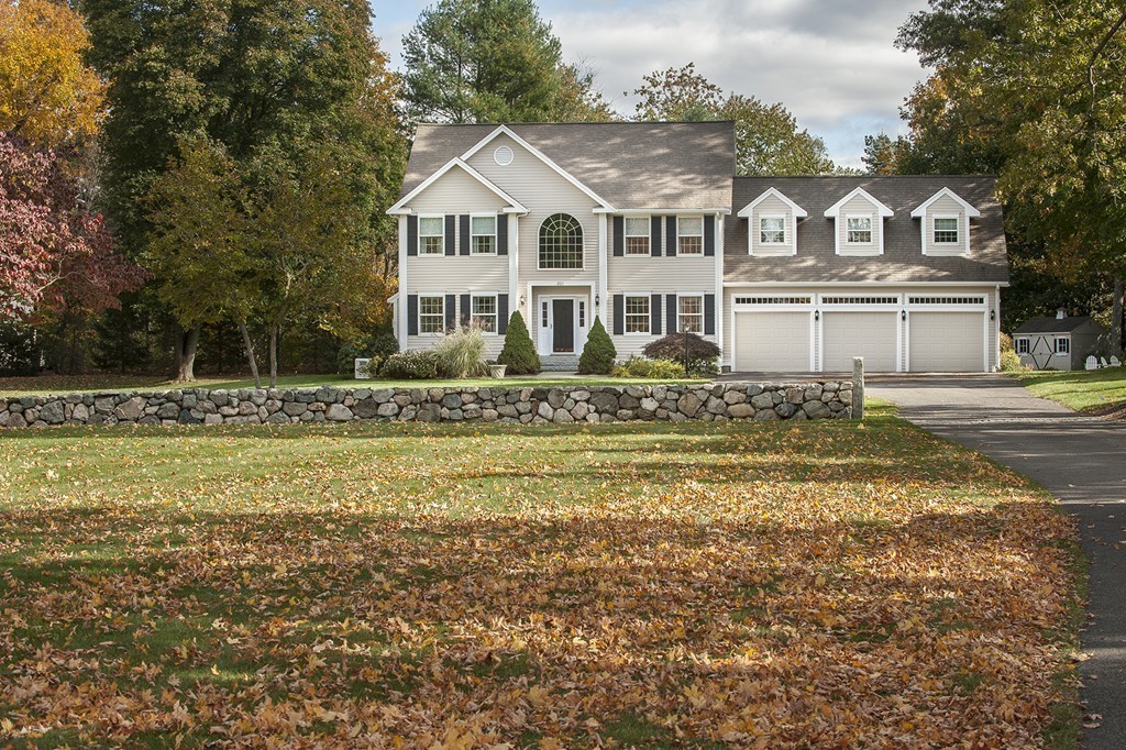321 Concord Road Wayland, MA 01778 - Photo 12 of 12 a front view of a house with a garden