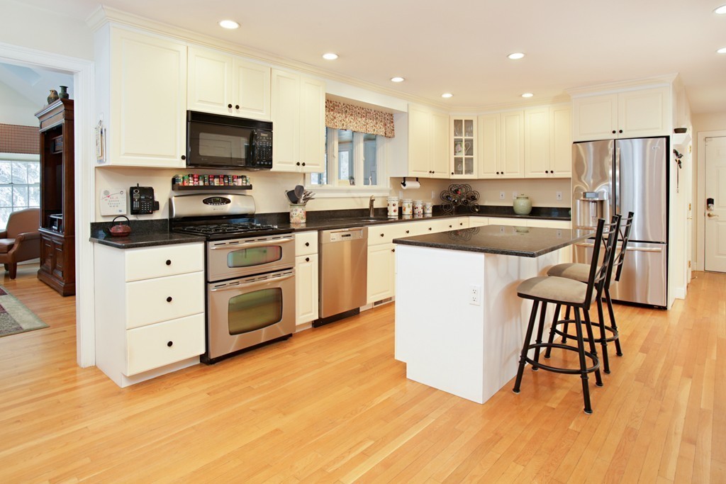 321 Concord Road Wayland, MA 01778 - Photo 3 of 12 a kitchen with stainless steel appliances a stove a sink a refrigerator and a microwave